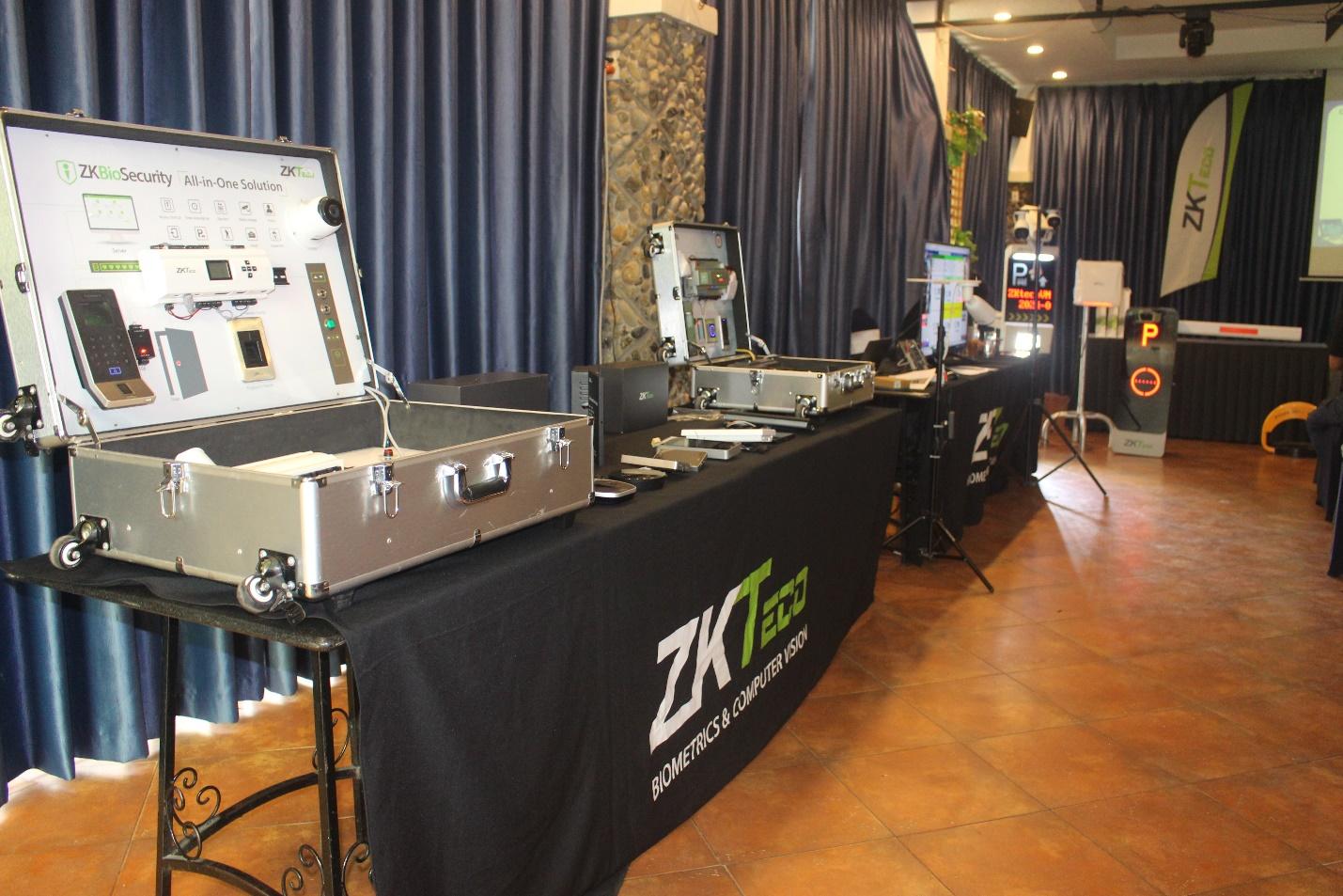 A table with a black tablecloth and a black tablecloth with a black tablecloth with a black tablecloth with a green and white text on it Description automatically generated